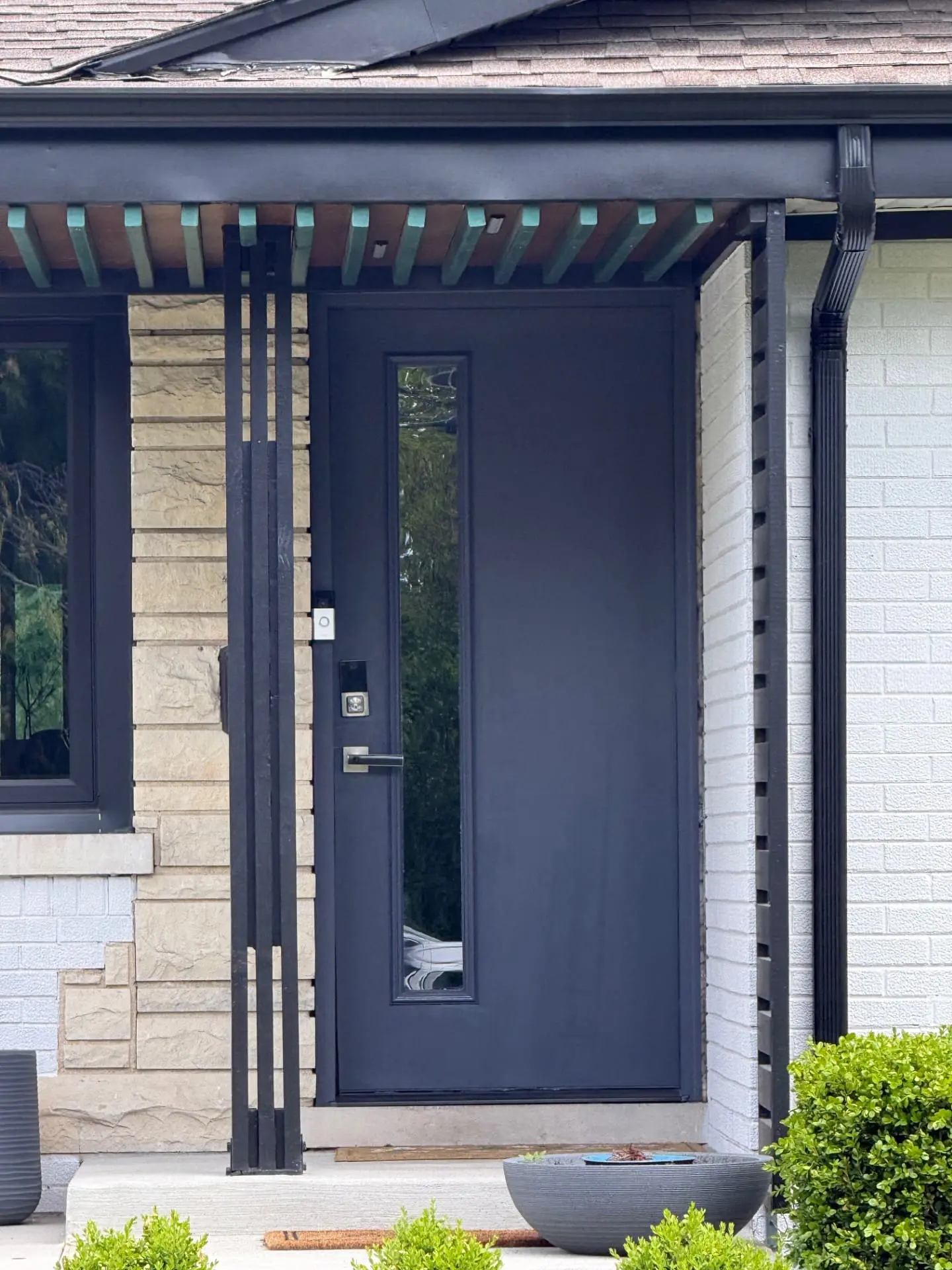 Front door replacement near North Avenue and York Street in Elmhurst, IL with new frame, brick molding, smart lock, video doorbell, and freshly painted finish.