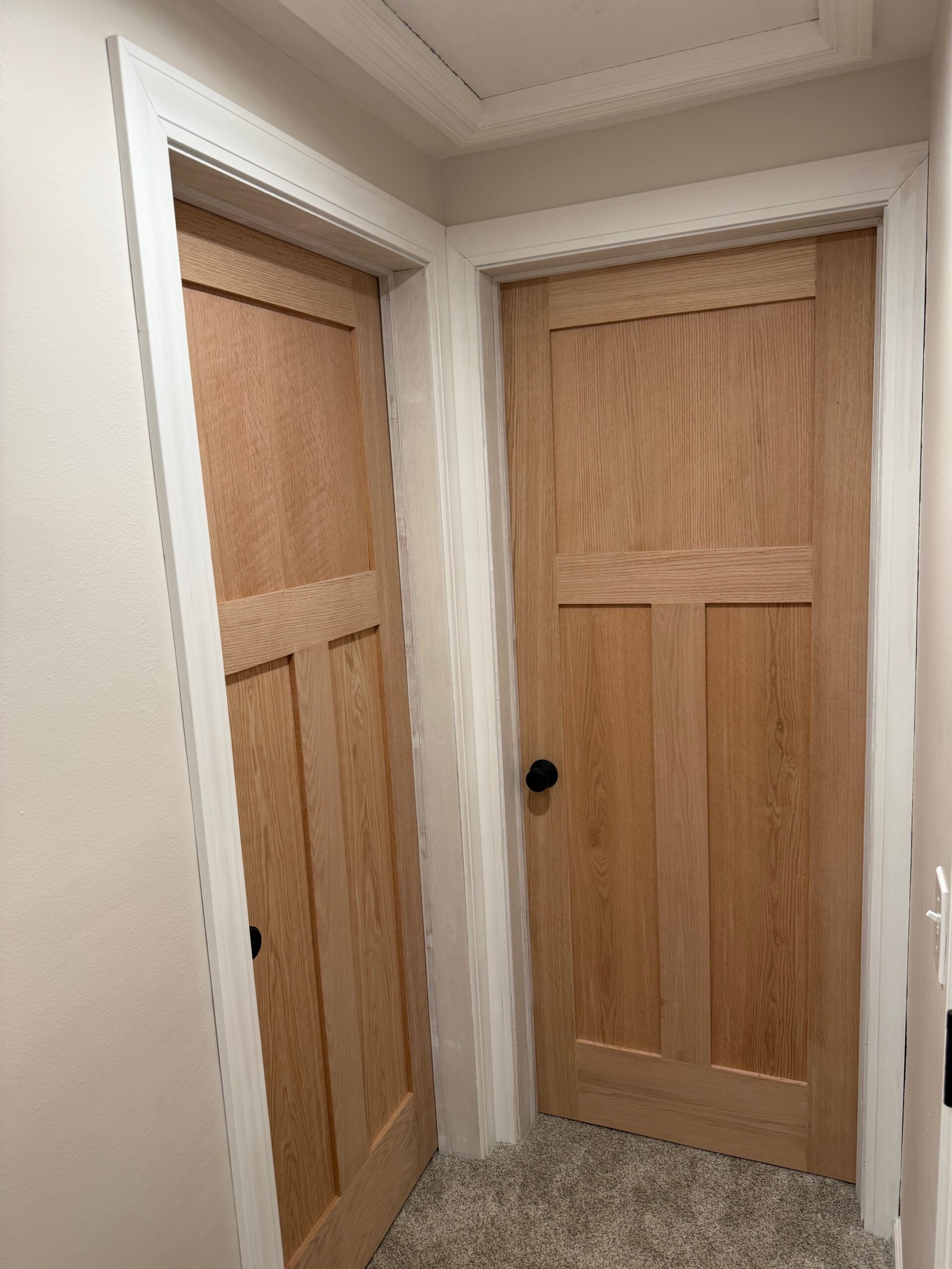 Five interior doors installed near the Villa Park Historical Museum with new trim molding, painted frames, and updated door knobs for a clean finished look.